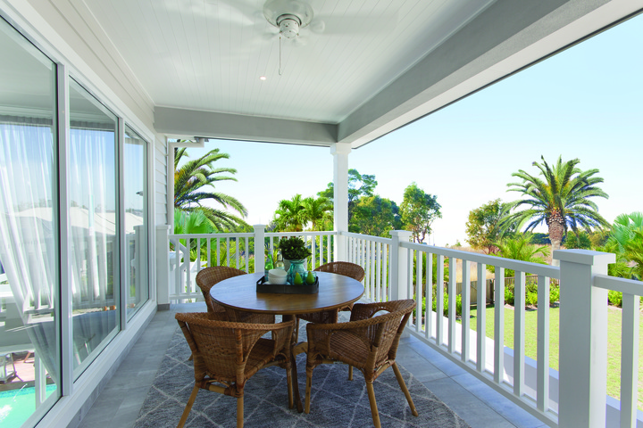 Sliding doors open out onto the balcony.