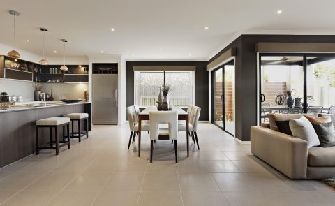 A dining area with large aluminium sliding doors featured
