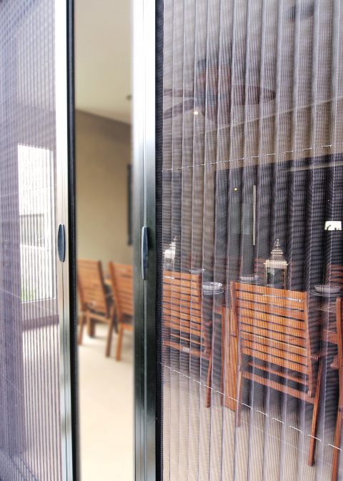 Is it possible to add a flyscreen door when the sliding door is on