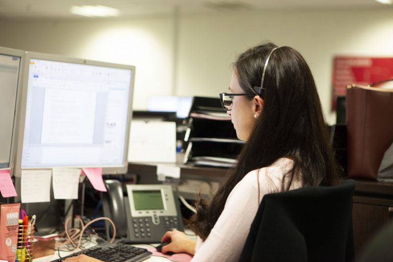 Staff member working at computer