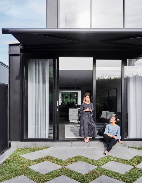 Backyard looking in to lounge through large sliding doors