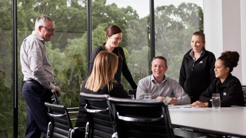 A&L Windows team members around table